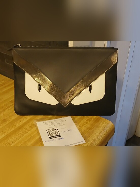 Fendi Handbags - Fendi LIKE NEW "Monsters" Clutch W/Coa